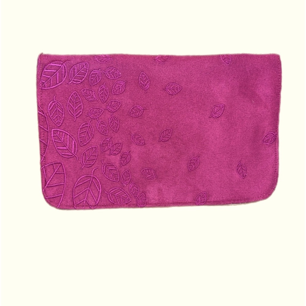 Velour suede like feel clutch with leaves on the front.New w/o tags.